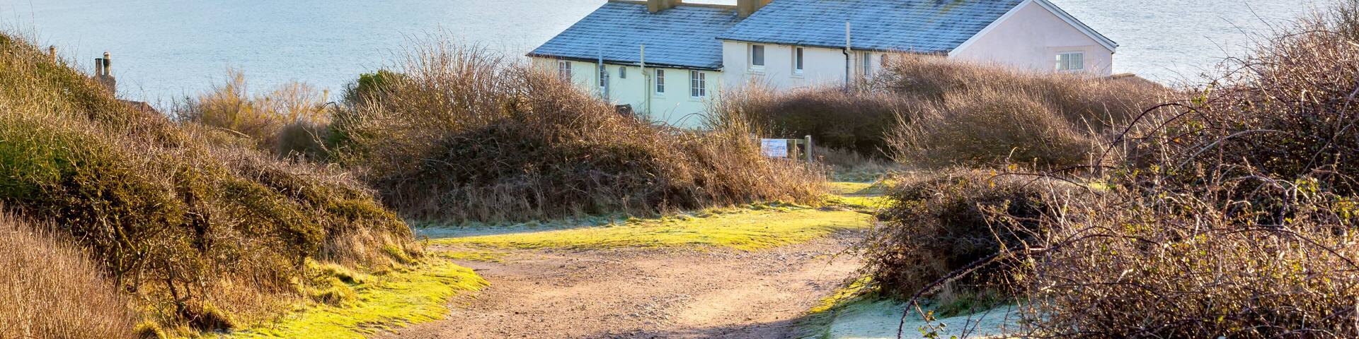 The Coast Guard Cottages and Seven Sisters Chalk Cliffs just outside Eastbourne, Sussex, England, UK.