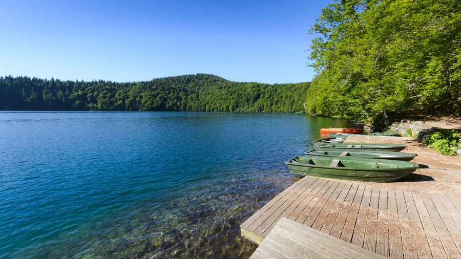 Lake Pavin in Auvergne with small boats and blue sky, Shutterstock ID 671260273, Purchase Order: -