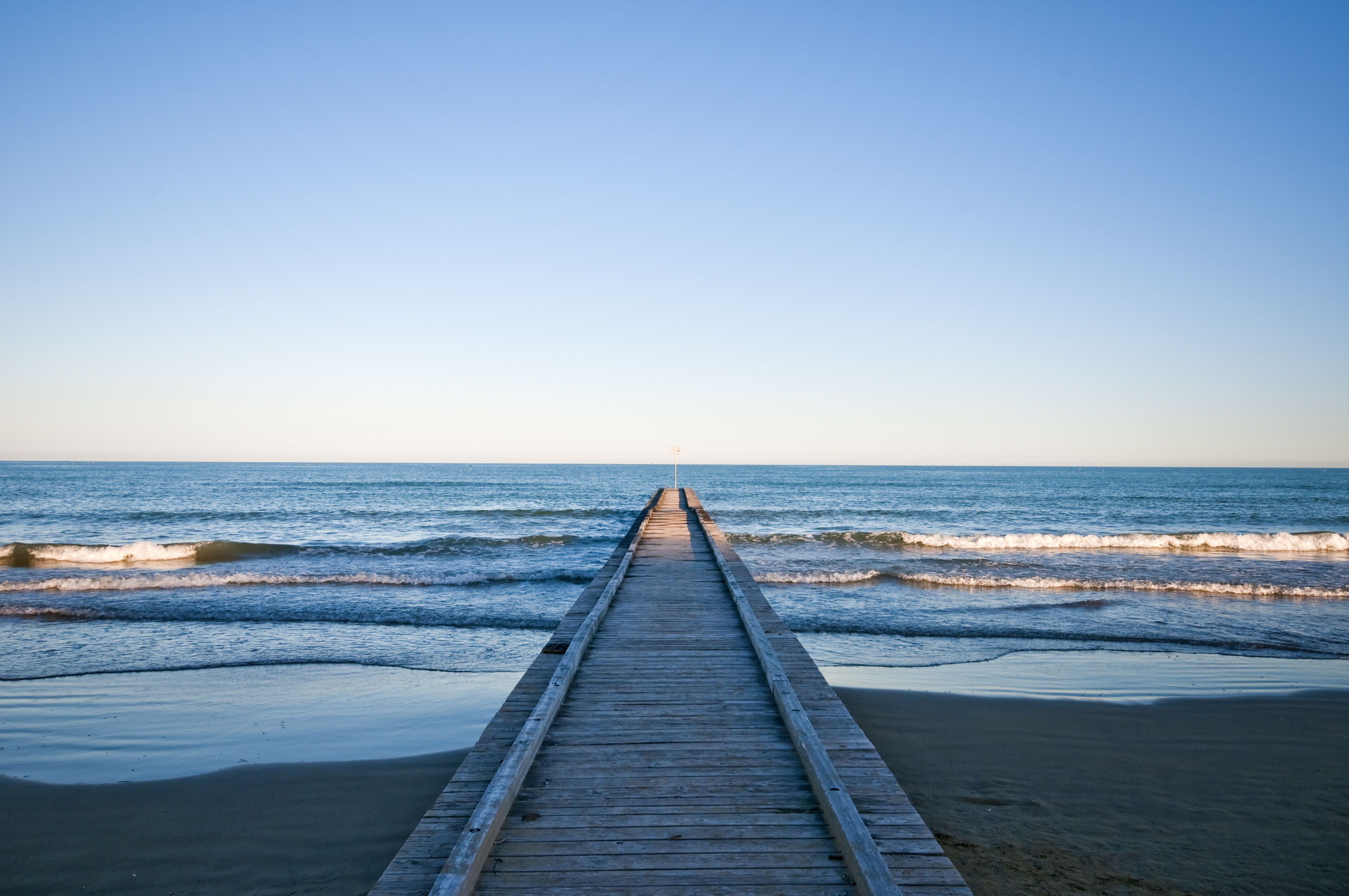 the beach in Lido di Jesolo , Italy during the sunset