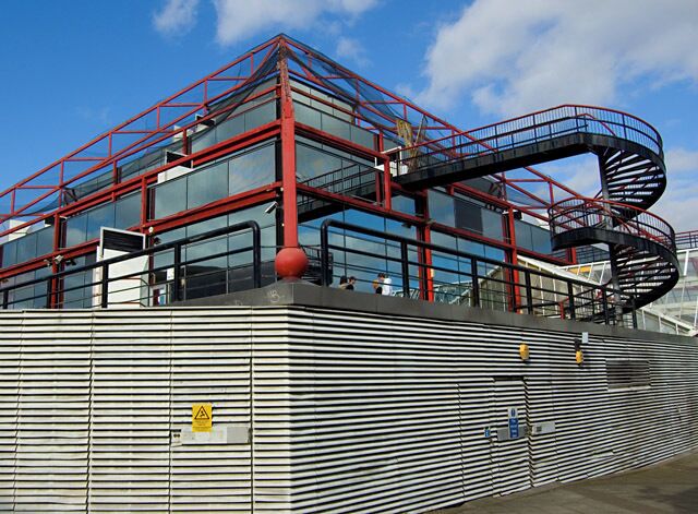Odeon, Milton Keynes A steel and glass ziggurat above the cinema, seen from Lower Ninth Street (one entrance is to the right of this shot). The structure also houses a youth centre called, perhaps tactlessly given adolescent skin complaints, "The Spot".