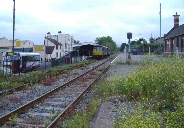 Avonmouth railway station Outside of peak hours, trains from Bristol terminate here. Passengers for Severn Beach must continue their journey, using the bus, seen waiting on the left of this picture.