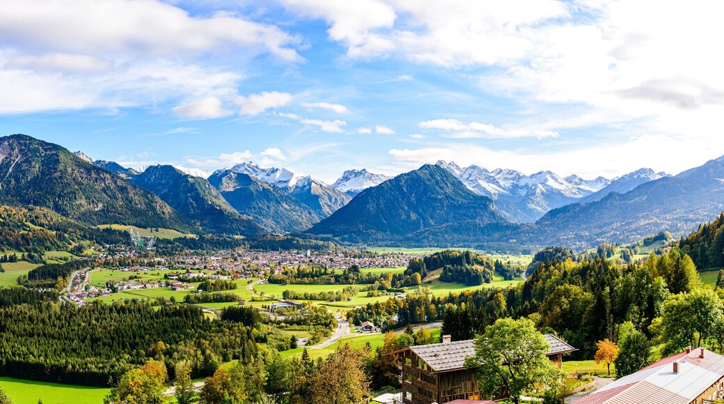 Panorama on Obersdorf in Allgau, Bavaria, Bayern, Germany. Rubihorn, Nebelhorn, Big Klottenkopf, alps in Tyrol, Vorarlberg, Mountains of good hope, blue sky, Rotgrundspitze, Rappenseekopf, Austria.