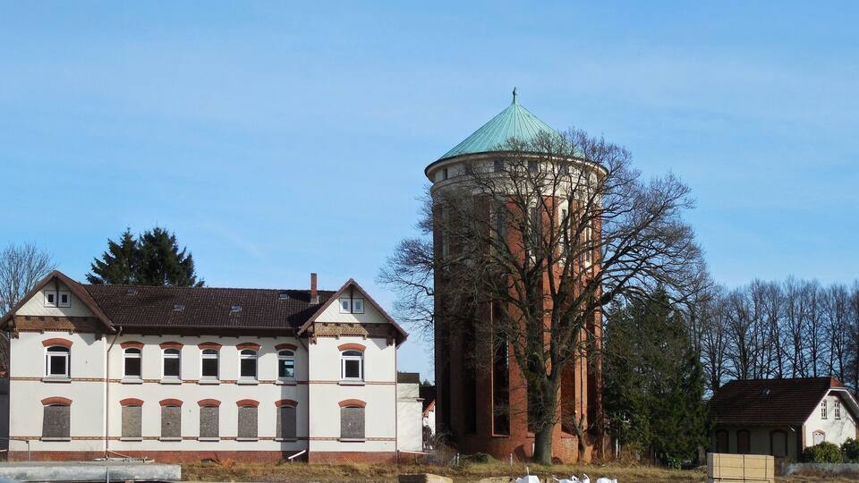 A historic building with a water tower.