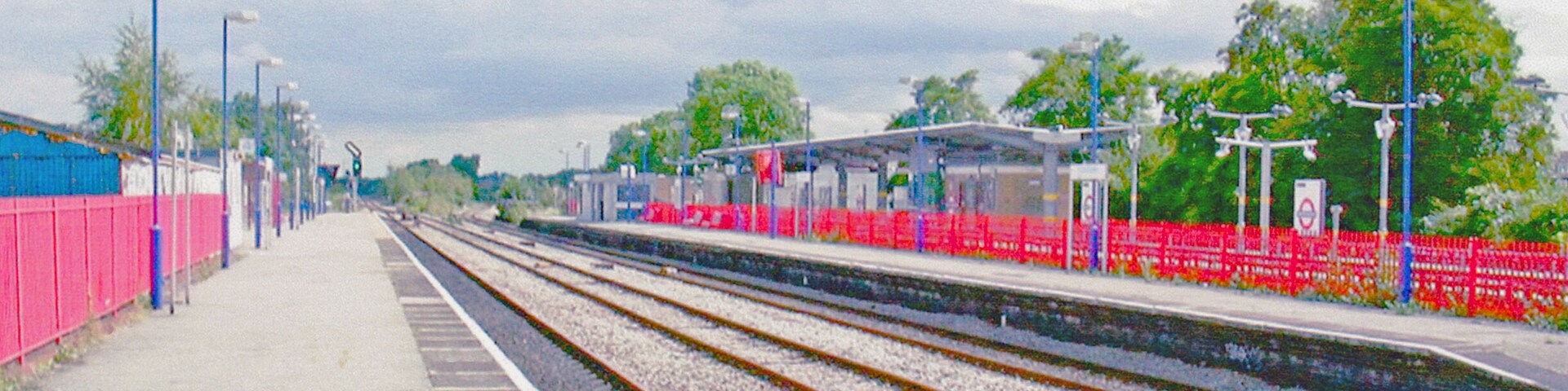 South Ruislip main line station. View SE, towards London Marylebone, formerly also Paddington: ex-GW&GC Joint 'Northolt Junction' of the ex-GC line from Marylebone via Neasden with the ex-GW line from Paddington via North Acton, separating east of here to the left and right respectively. The ex-GW (Acton - Northolt) line has seen very little passenger traffic since this route into Paddington lost regular services in the 1960s. Local trains to/from Marylebone continue at these platforms, but the LUL Central Line platforms over on the right are far busier