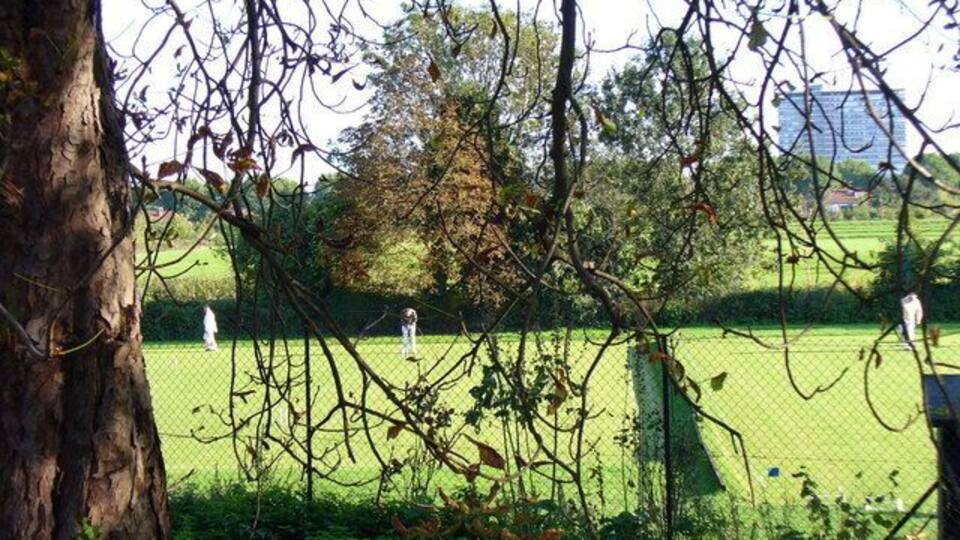 Surbiton Croquet Club Sunday Sport in Suburbia. Tolworth Tower is in the distance.