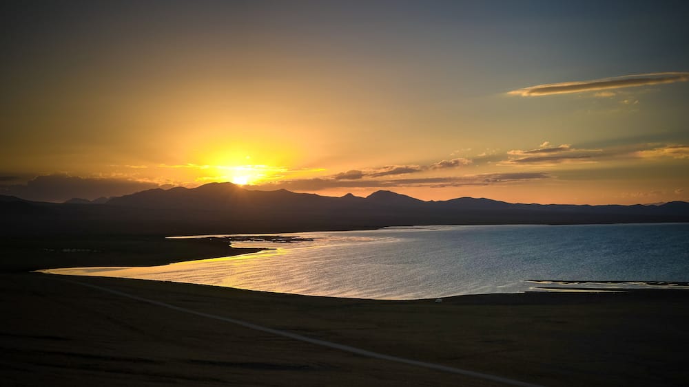 Panorama of Song Kul lake at the sunset, Kyrgyzstan