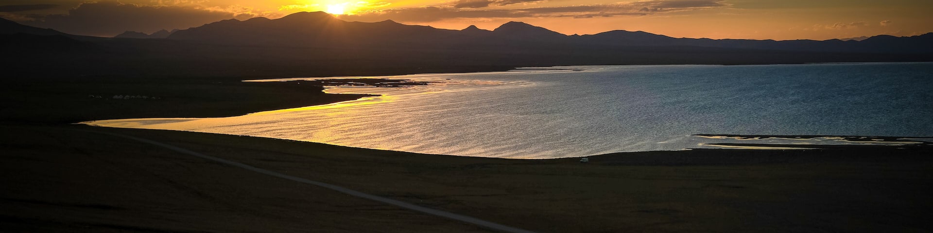 Panorama of Song Kul lake at the sunset, Kyrgyzstan