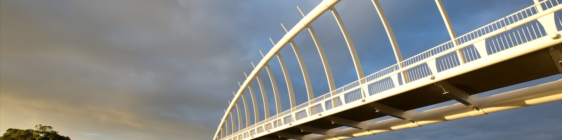 Te Rewa Rewa Bridge featuring a river or creek, a sunset and a bridge