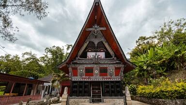 Traditional Toba batak houses with pointed roofs at Samosir island at Toba lake North Sumatra Indonesia