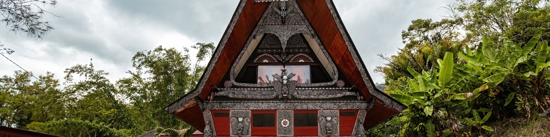 Traditional Toba batak houses with pointed roofs at Samosir island at Toba lake North Sumatra Indonesia