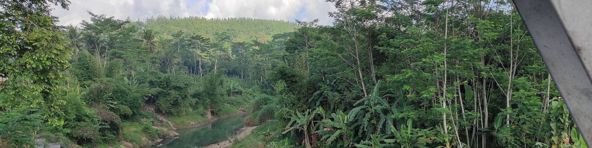 View of the small river from the bridge in the Banjar area, Indonesia