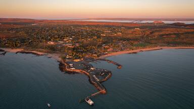 Aerial view of picturesque coastline at sunset with serene beach and tranquil ocean, Pilbara Region, Ashburton, Australia.