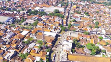 Abstract Defocused Aerial photography Public highway that divides the dense and spacious residential area of Majalaya - Indonesia, Not Focus
