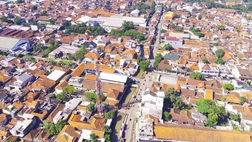 Abstract Defocused Aerial photography Public highway that divides the dense and spacious residential area of Majalaya - Indonesia, Not Focus