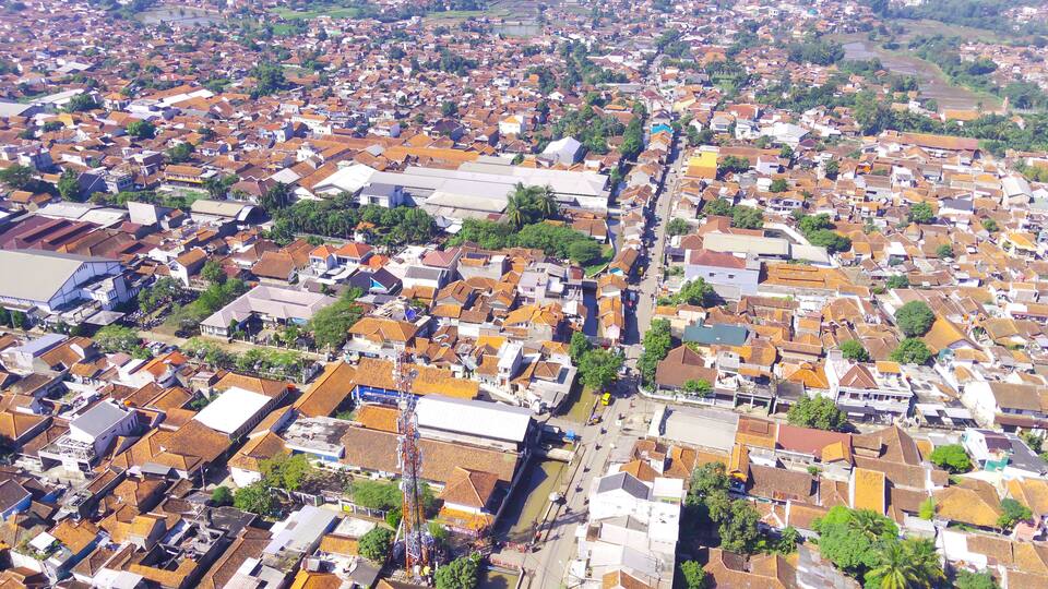 Abstract Defocused Aerial photography Public highway that divides the dense and spacious residential area of Majalaya - Indonesia, Not Focus