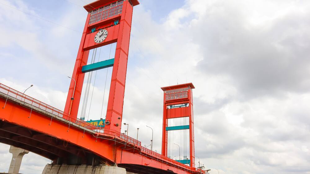 The red Ampera Bridge in Palembang City, South Sumatra, over the Musi River