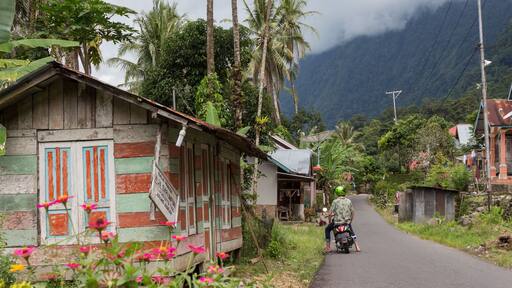 Travel Tourist in Indonesia on scooter at Danau Maninjau in Sumatra