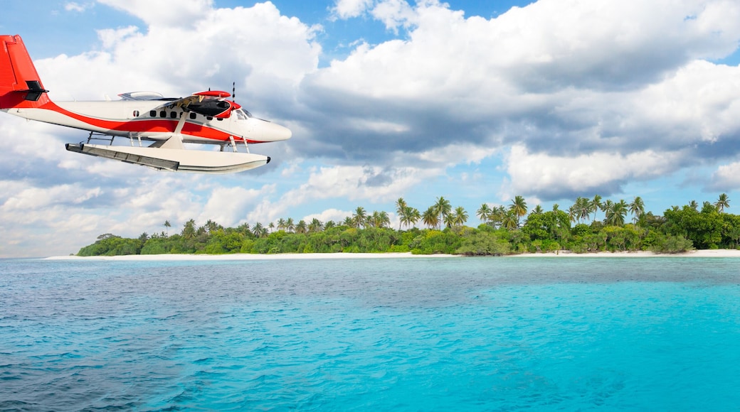 Sea plane flying above Maldives islands