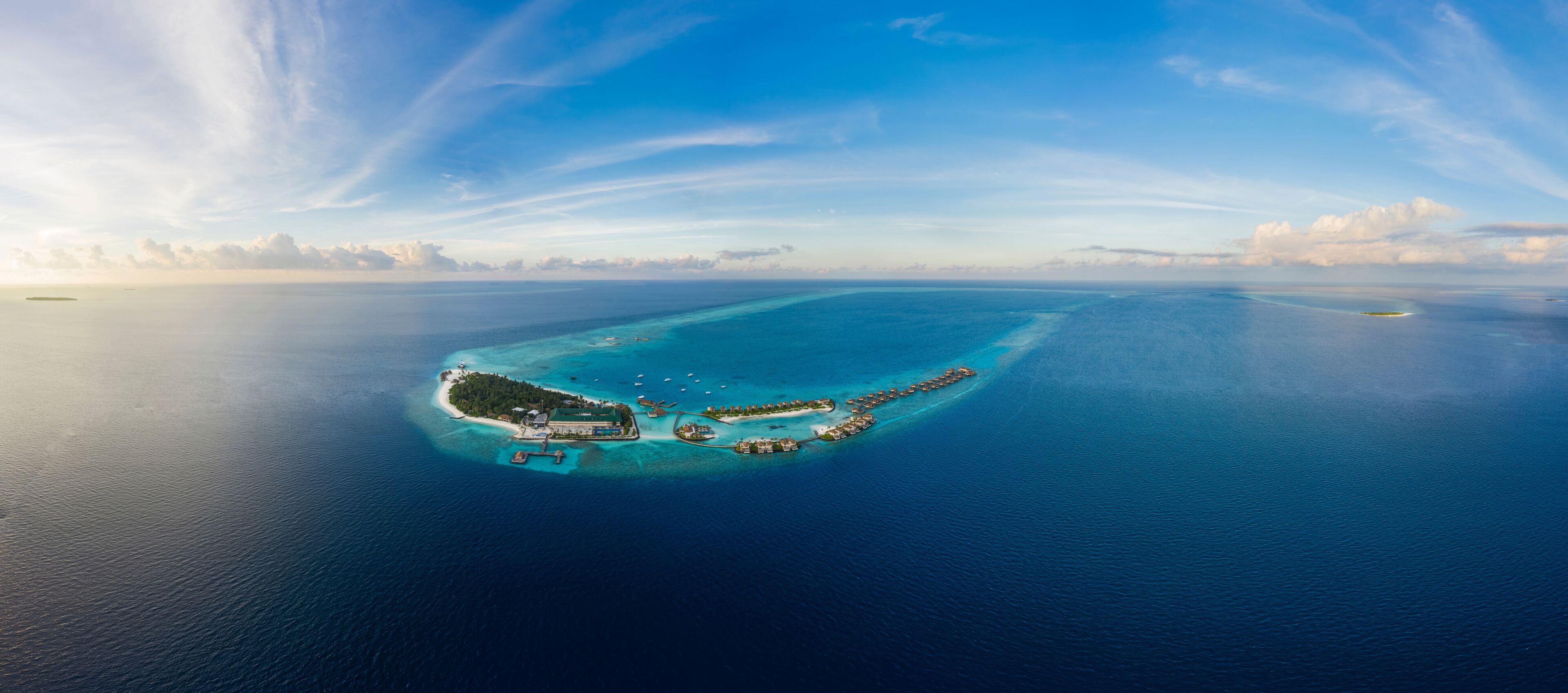 Panoramic aerial view of Raa Atoll at sunset in the Laccadive Sea, Maldives archipelagos.