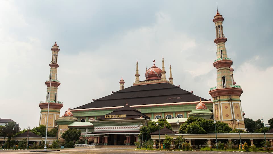 A mosque with two minarets and a large central dome.