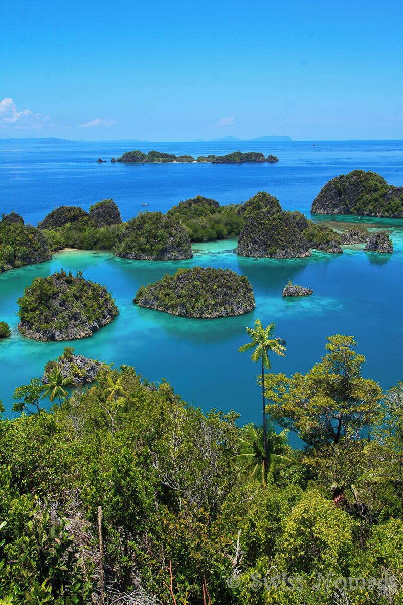 A tropical archipelago with numerous small islands surrounded by turquoise waters.