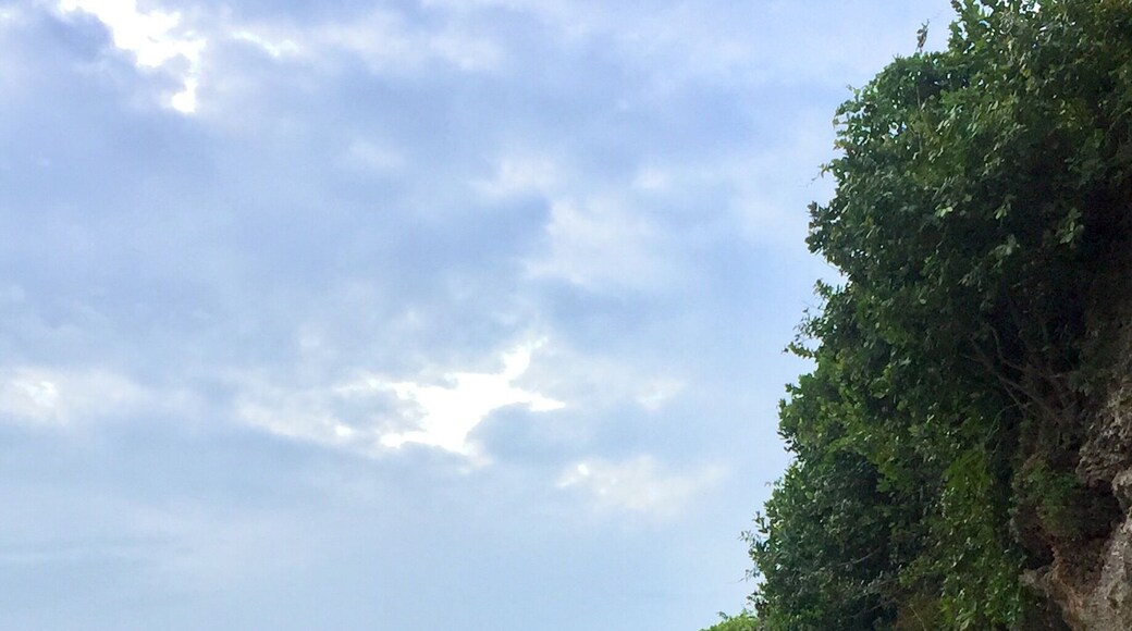 This amazing beach by the rocks is all what you need!