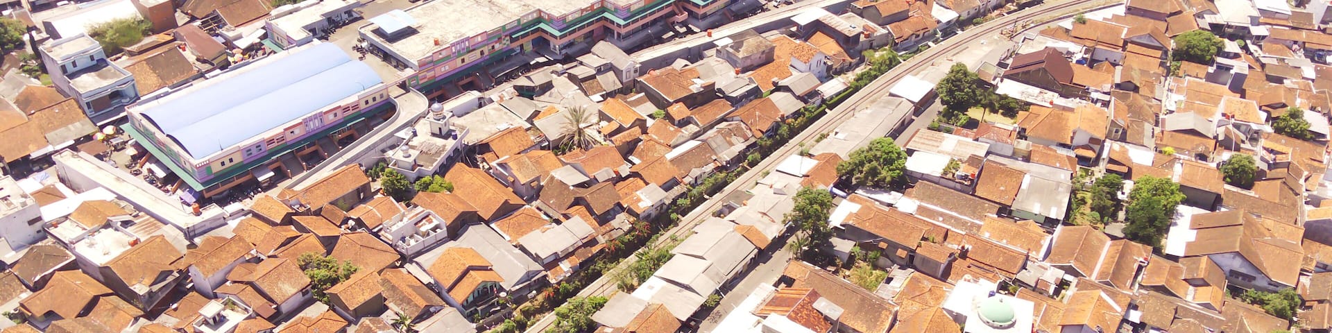 Bird eye view Train track or Rail Track from aerial perspective. Aerial shot of Rail track in the middle of the city. Transportation Industry. Mode of Transport. Cicalengka - Indonesia