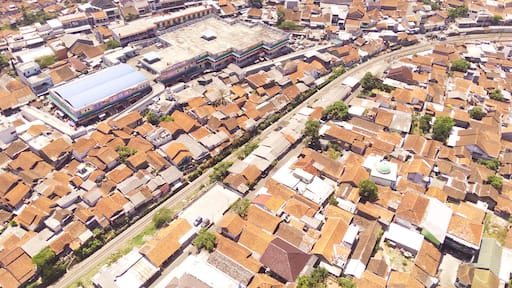 Bird eye view Train track or Rail Track from aerial perspective. Aerial shot of Rail track in the middle of the city. Transportation Industry. Mode of Transport. Cicalengka - Indonesia