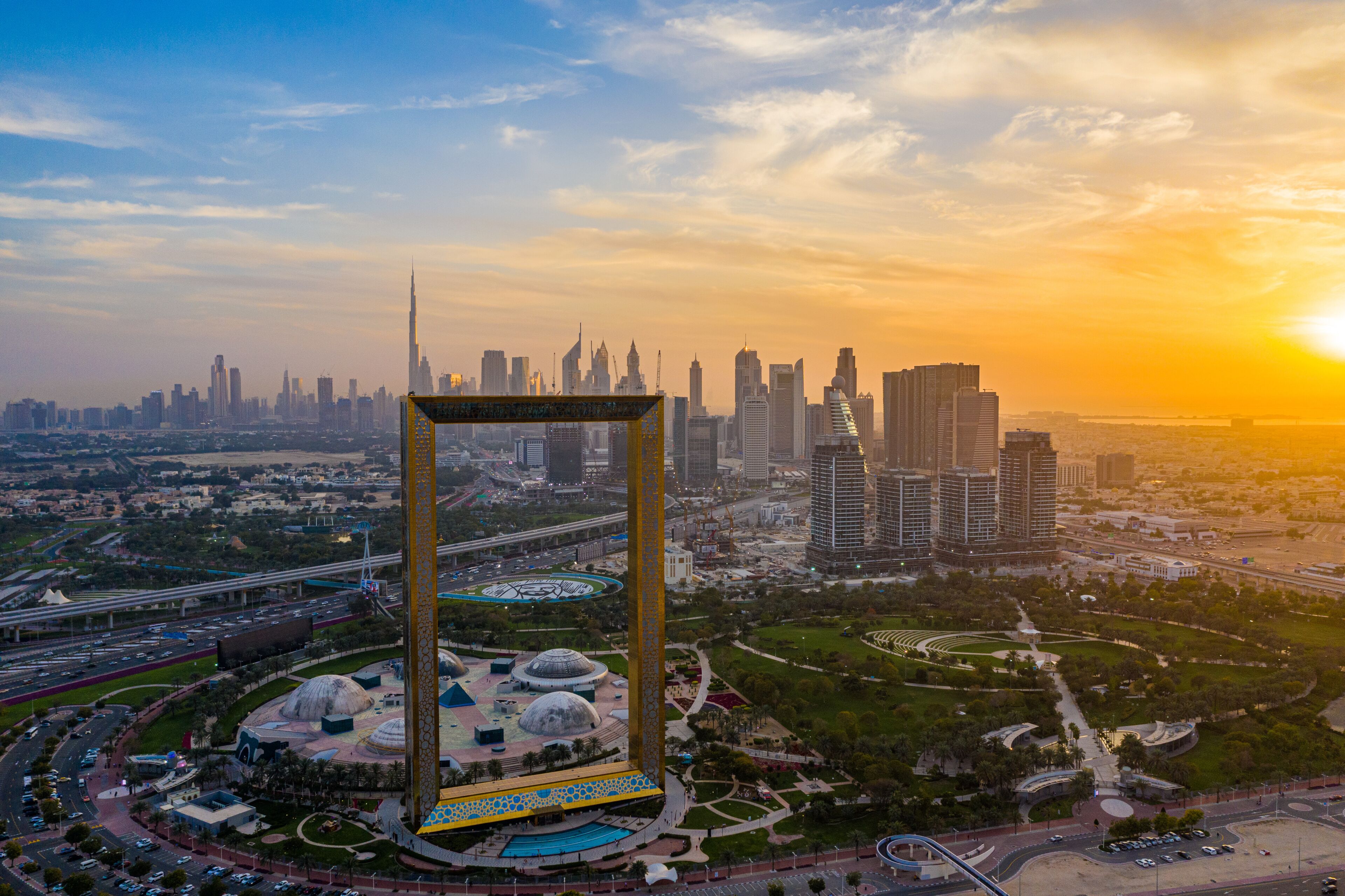 Futuristic city skyline of Dubai during a golden hour sunset