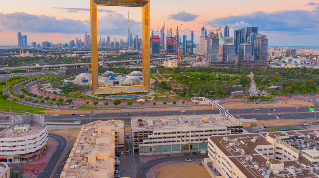 Aerial view of Dubai Frame, Downtown skyline, United Arab Emirates or UAE. Financial district and business area in smart urban city. Skyscraper and high-rise buildings at sunset.