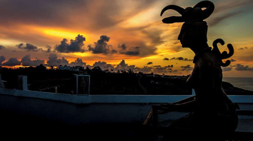 Goddess Ixchel basking in the golden glory of sunset.
This is the statue of the lady of rainbows, the moon goddess , the fertility goddess of Mayans. This monument is located at Punta Sur, the southern most part of Isla Mujeres. Punta Sur is magnificent.
The history and the natural beauty is overwhelming! There is a small amount of fee to enter the monument but it is worth paying. Sunset views are breathtaking from the cliffs of Puta Sur. There are a few local small shops to get souvenirs and some drinks.
Tip : Rent a golf cart to ride to Puta Sur from your hotel or from North Beach (if you are on a day trip from Cancun).
#golden photo contest#beautifulmonuments#mexico
