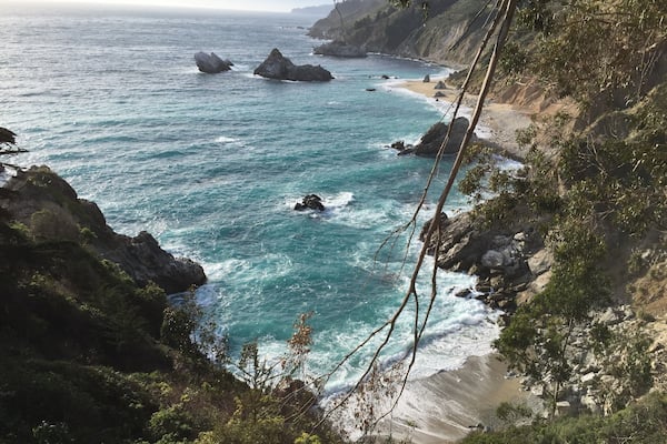 McWay Beach in Big Sur is a picturesque beach in a small cove. A waterfall of the same name is the big attraction here, although it can't be seen in this picture. #LifeAtExpedia