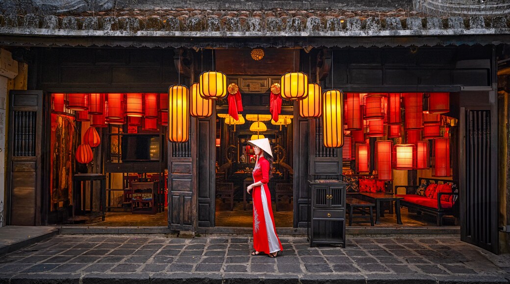 A traditional Chinese building with ornate lanterns and red decorations.