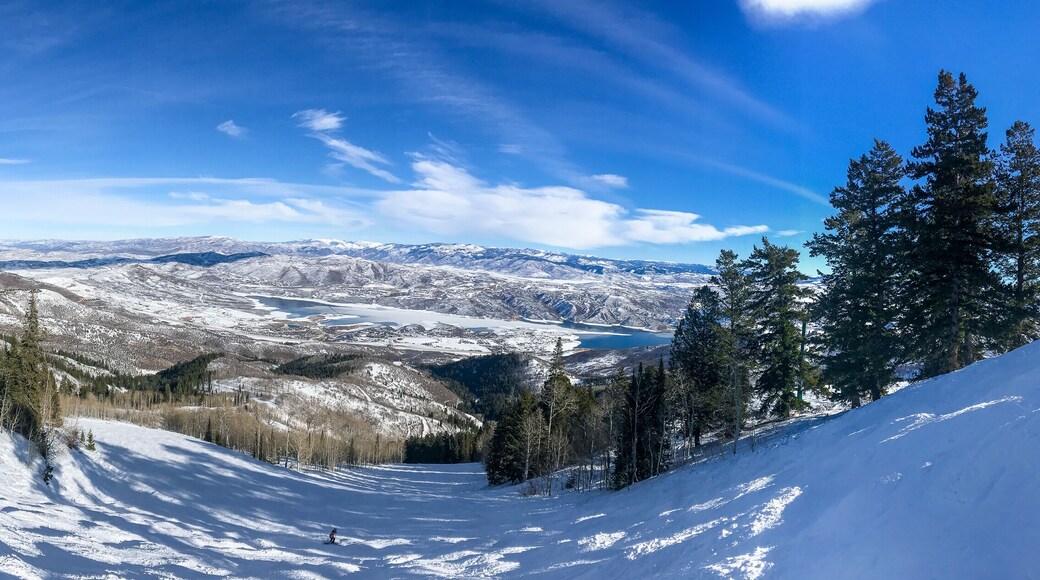 Panoramic view of Wasatch mountains at winter time as seen from Deer Valley resort.