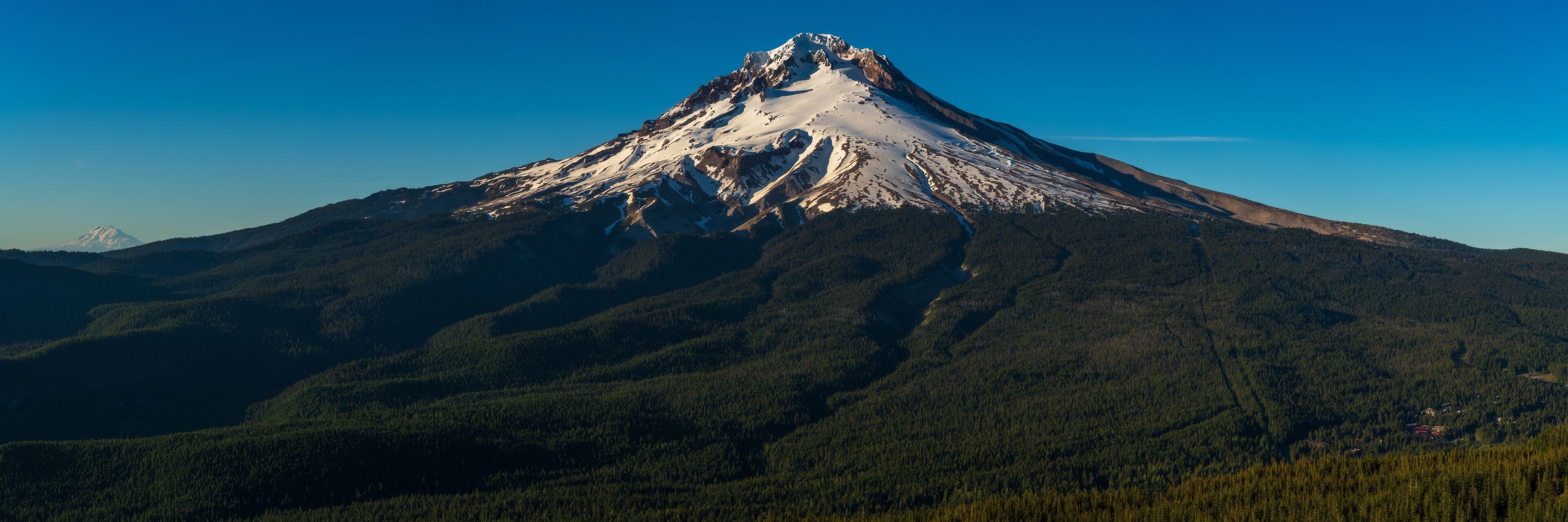 A snow-capped mountain with a clear sky.