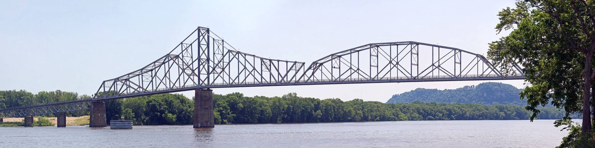 Wide Panorama, view from the North. Black Hawk Bridge over the Mississippi River, joining Lansing IA, to Crawford County, WI. The bridge is a riveted cantilever through truss bridge.