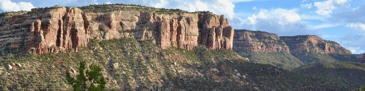 Colorado National Monument road. Scenic drive towards the massive red sandstone and granite plateaus.