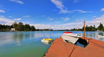 View of wooden pier with blue lake Tapps ,sky background