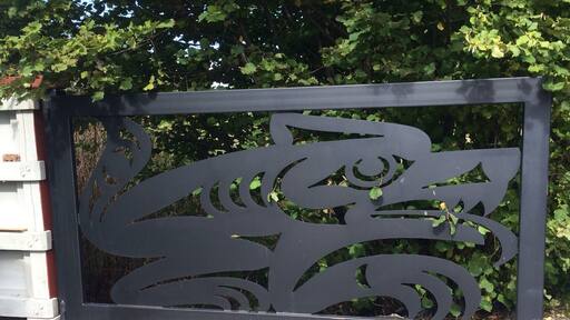 Believe it or not, this is the gate to the refuse and recycling pen for the Community Center of the Jamestown S'Klallam Tribe. Sure beats a slatted cyclone fence.