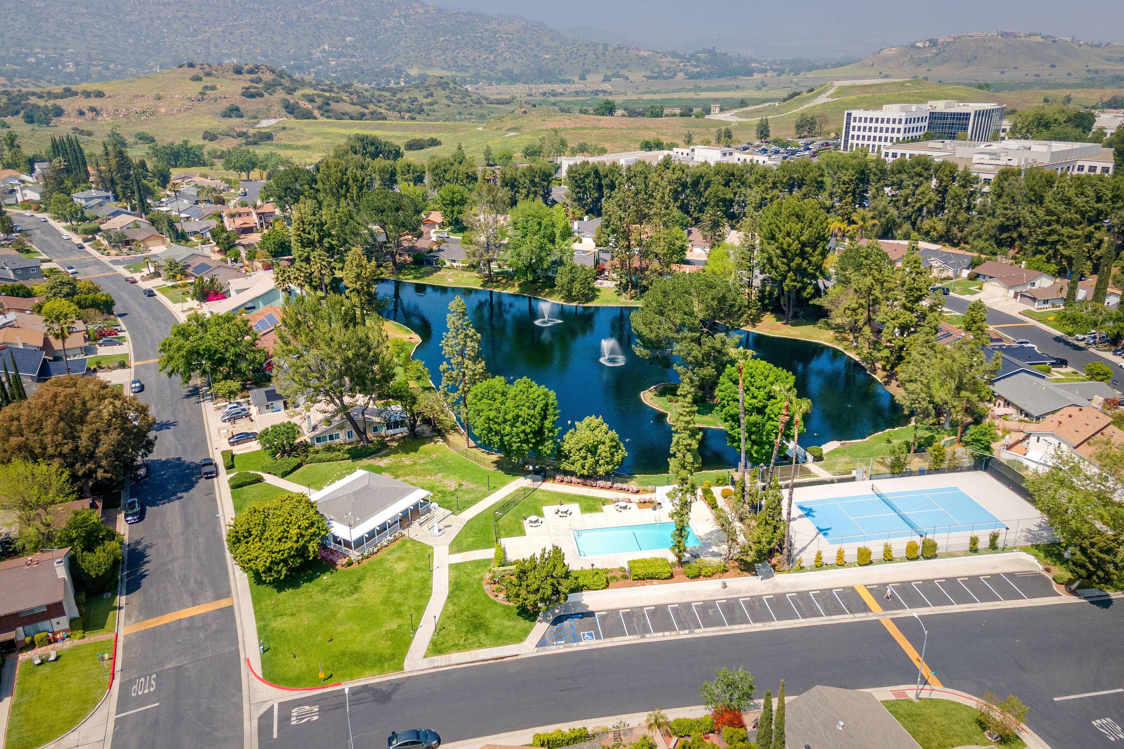 West Hills, LA Los Angeles County, CA, California, April 22, 2024: Aerial Drone City View toward Roscoe Blvd, Woodlake Ave, Lees Lake with Homes, Houses, Apartments, Streets
