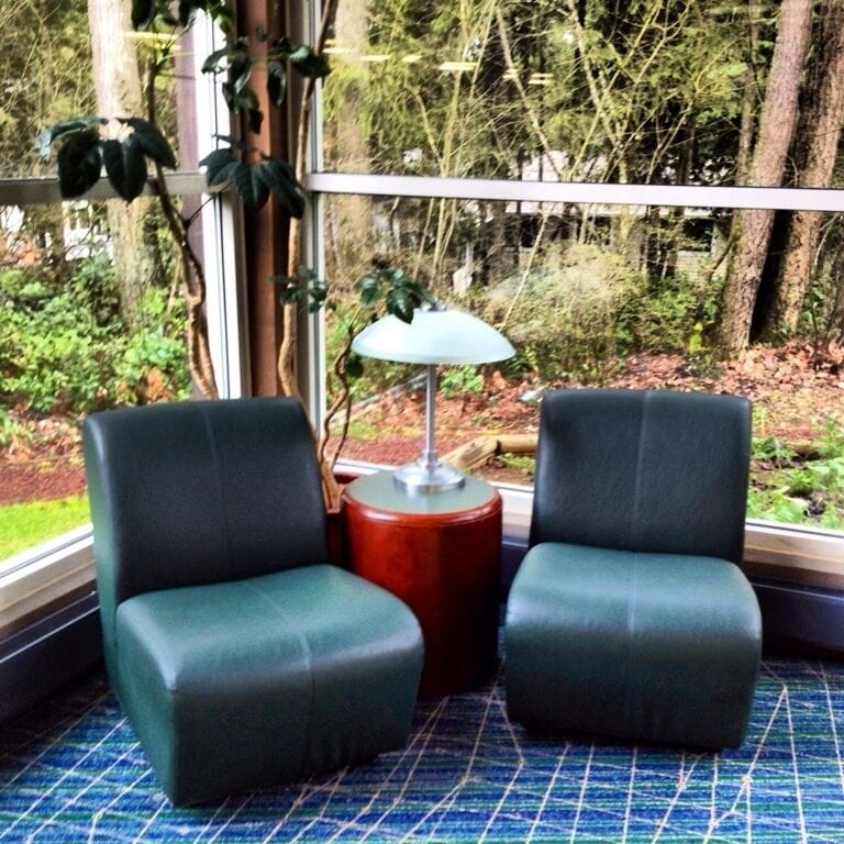 A great place to read or get a little work/internet browsing done. Looks like you have to depend on battery life while sitting here and move away from the windows when you need to plug in, but... that's okay. Some time in natural light is better than none.