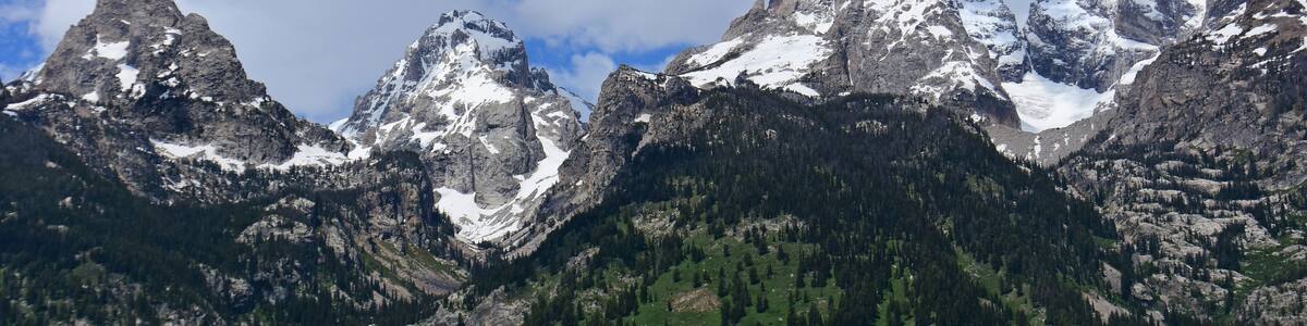 the magnificent south tetotn, middle teton, and garnd teton peaks in summer in grand teton national park, wyoming
