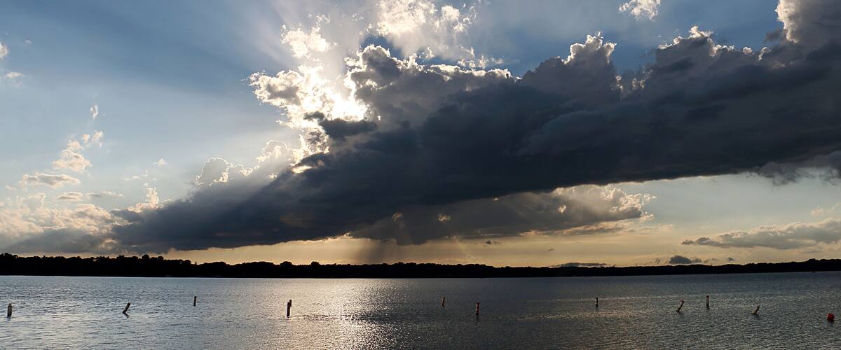 Backlit Evening Rain Shower over Medicine Lake in Plymouth, Minnesota