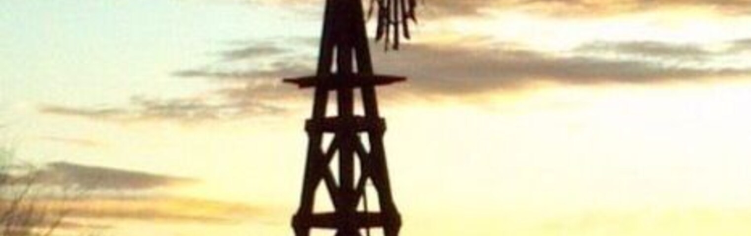 I stopped on the side of the road somewhere between Colorado and Nebraska to photograph the sunset and this Wind mill using a cell phone