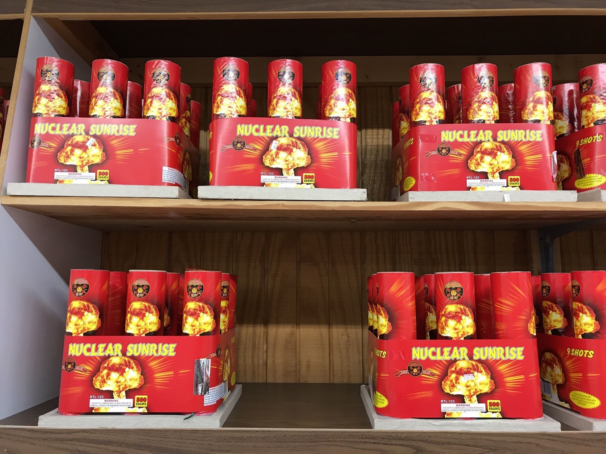 Shelves stocked with 'Nuclear Sunrise' fireworks.