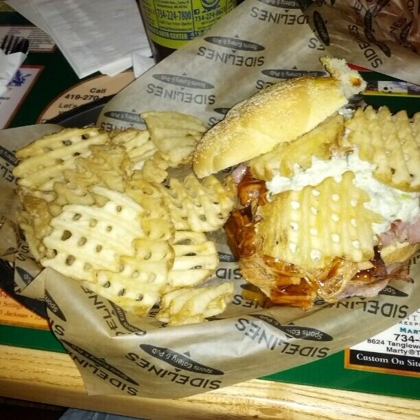 Behold, the Porkzilla! Grilled ham, bacon, pulled pork, barbeque sauce, coleslaw and waffle fries on a kaiser roll! 