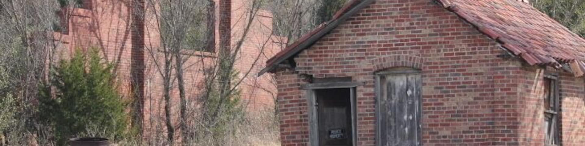 This gem is East of Peru Kansas
One can see a very small portion
of this great plant from hwy 166
it is private property
with no trespassing
I know the owner and obtained permission
Located in Chicago Ill. the Sprawling Field Museum
Should be of particular interest to Residents of Peru Kansas
and the people of Chautauqua County.
The exhibit is a roofing tile. The descriptive card is inscribed
"The finest Tile in the world.
Made in Peru Kansas.
The factory is nothing but a bunch of old brick structures
that have fallen into total dis-repair over the years.
There are trees growing taller up thru that are
taller than the building themselves
It all started around 1904 when oil was discovered
resulting and major oils boom.
according then postmaster Helena Anderson
Sometime in the early 1920's,
Spanish -Mission type architecture became popular.
A company out of Chicago bought the
plant and made nothing but roofing tile to meet the growing demand.