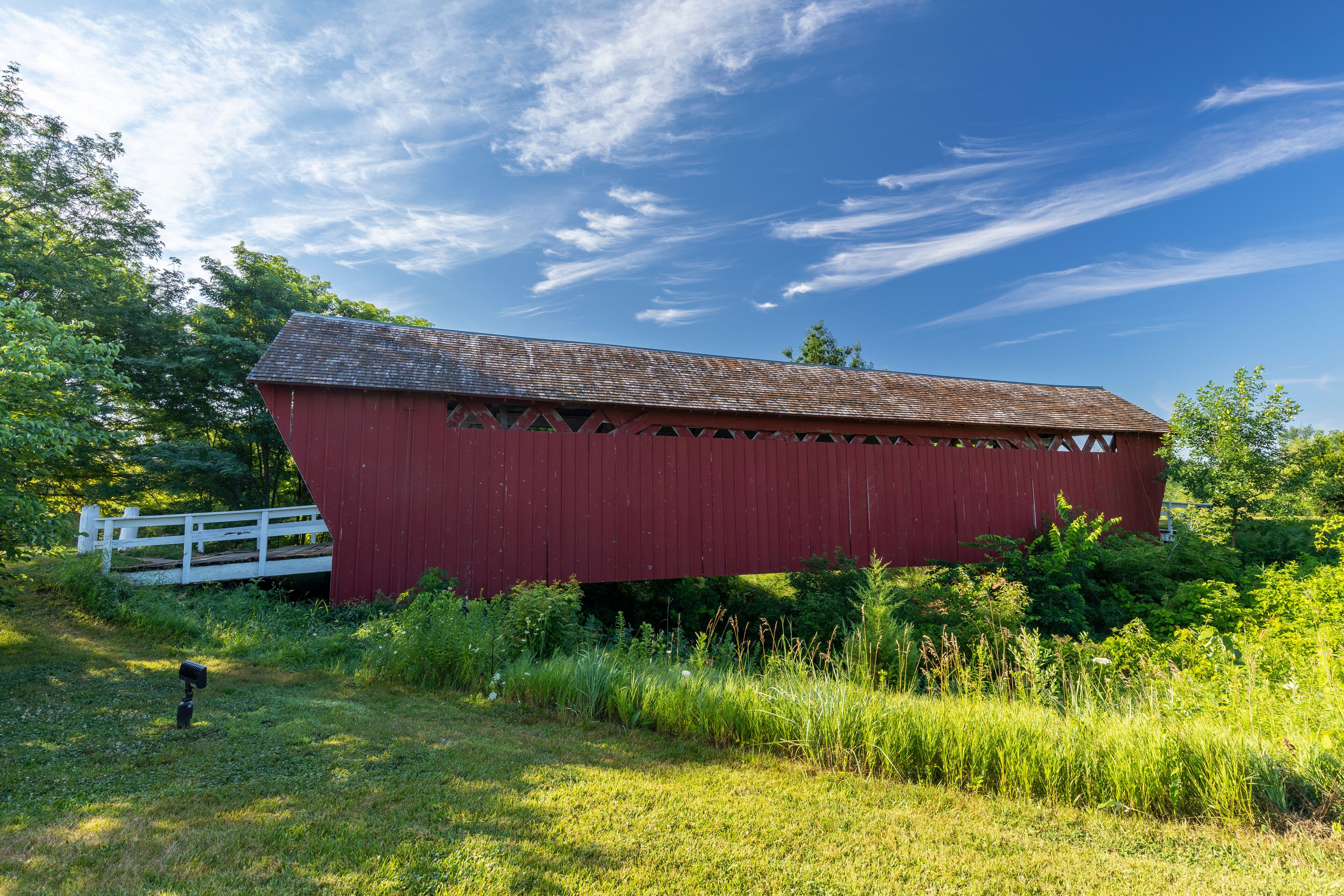 A red and white covered bridge.