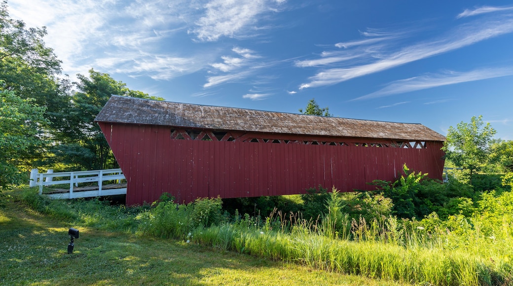 A red and white covered bridge.