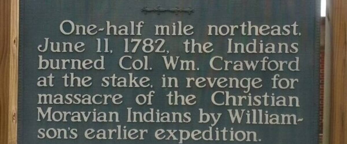 A historical sign about the Burning of Crawford.